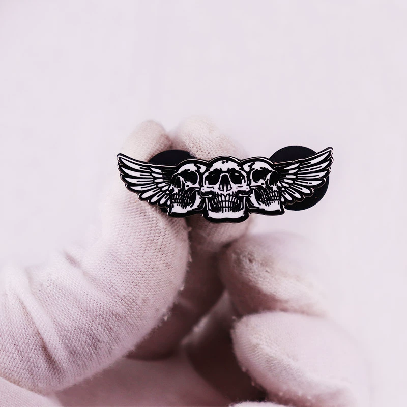 Three winged skull chest needle badges