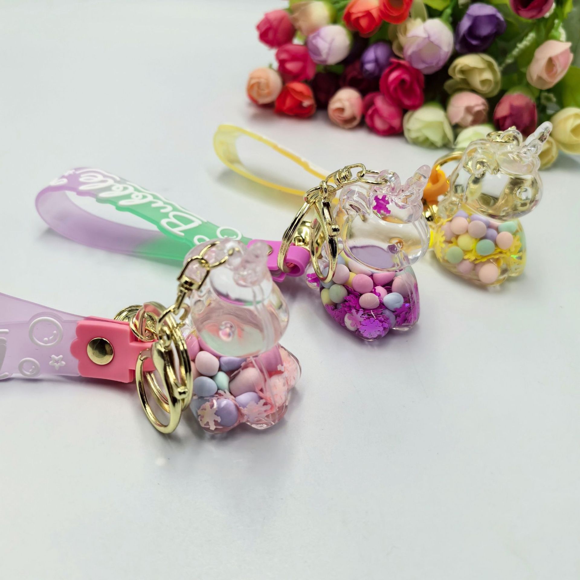Aceite de copo de nieve azúcar colorido frijoles unicornio llavero colgante bolsas colgantes bolsas colgantes regalo creativo para estudiantes
