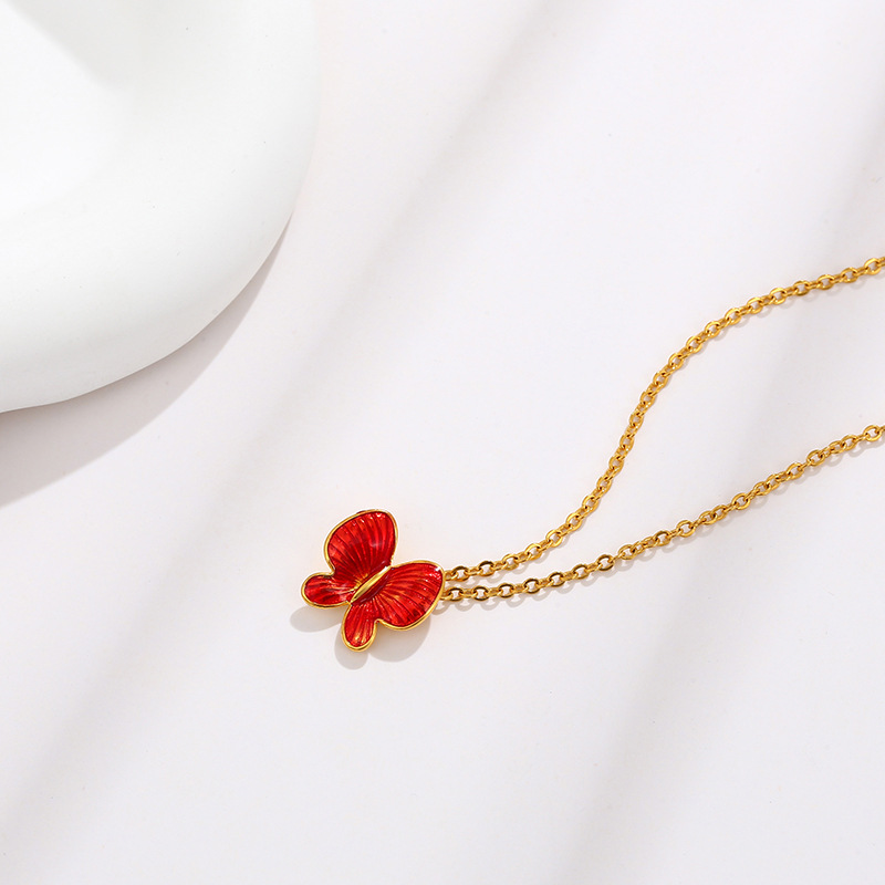 Joyería de xupe colorido esmalte gota aceite mariposa colgante temperamento femenino Corea del Sur simple nicho colgante de verano joyería