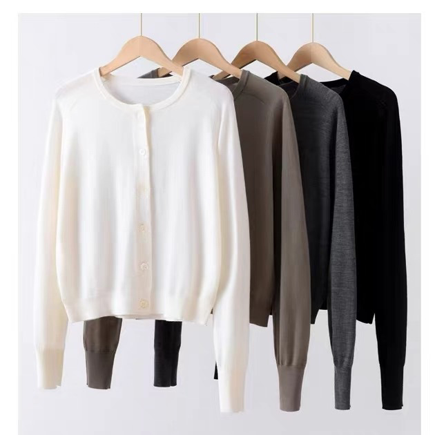 Woolen spring summer cardigan with a round collar