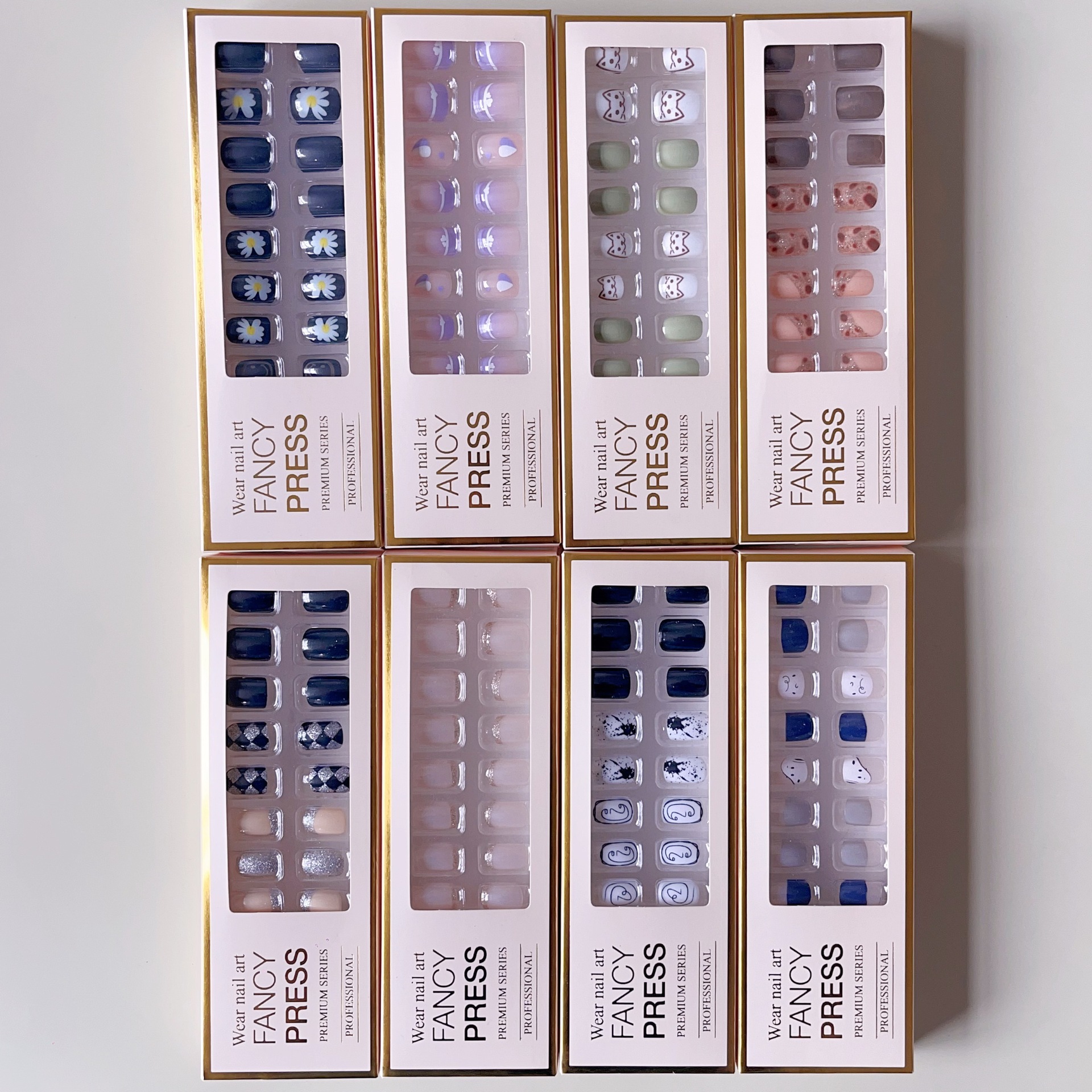 Los fabricantes venden al por mayor las nuevas piezas de uñas de salón europeas y americanas, 24 piezas, conjunto de uñas de mano, pegatinas terminadas, caja blanca pequeña, fuente de tienda de 2 yuanes