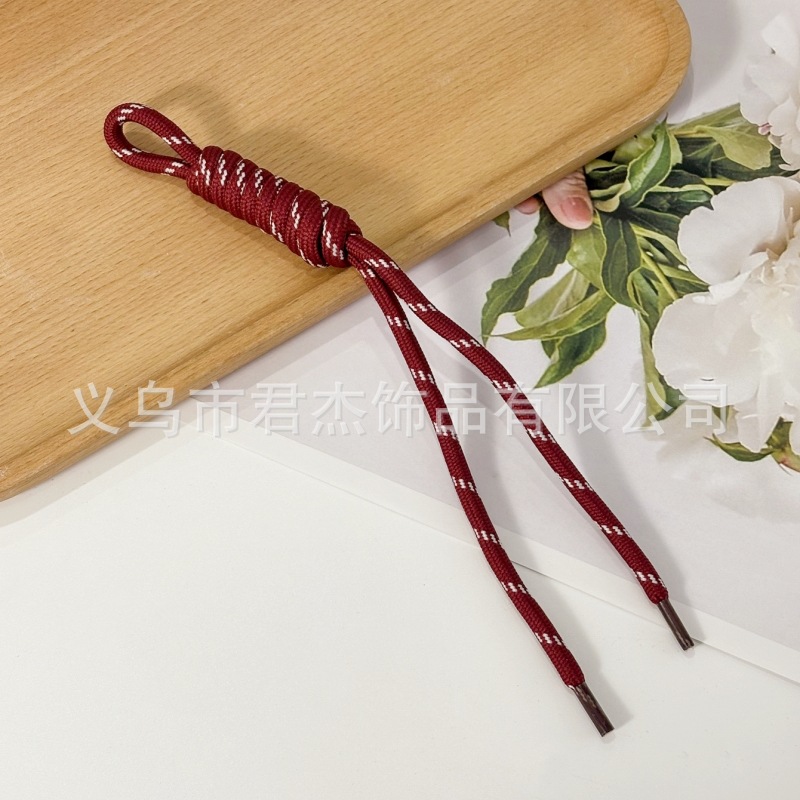 編みカバンのストラップの螺旋の結び紐のiuは鍵のボタンのネットの赤い色の結びの縄の装飾の部品を結びます。