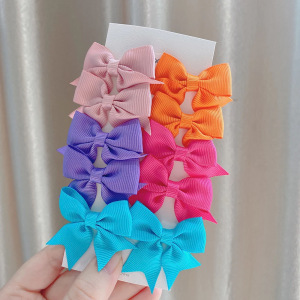 Juego de horquillas con lazo de cola de milano para niños de estilo caliente de Amazon, lindo y versátil, horquilla diaria para niñas europeas y americanas 323