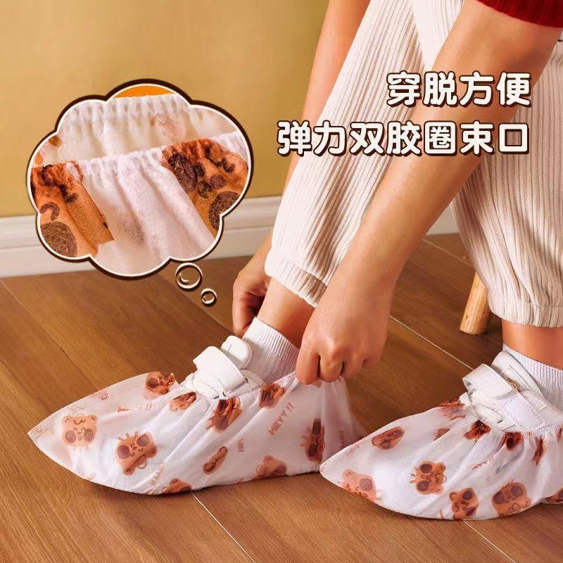 cartoon non-woven shoe covers household disposable thickened anti-slip temple tip indoor wear-resistant stain-resistant adult printing shoe protector
