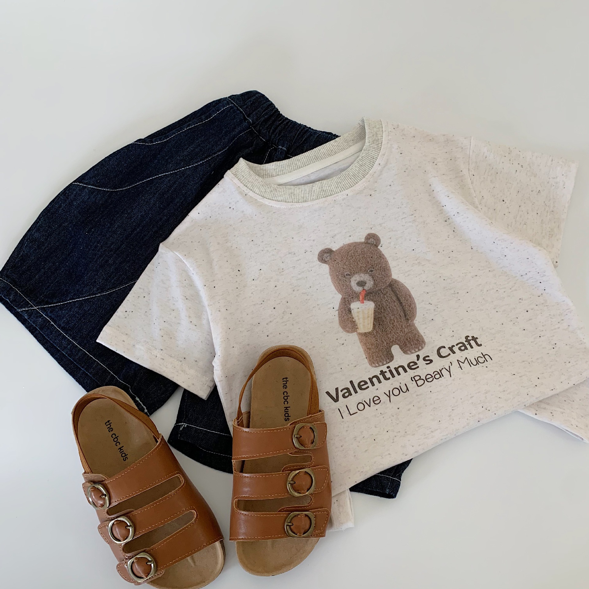 Mai Bao niños de verano camiseta de mangas cortas 2025 nuevo estilo coreano para niños y niñas de dibujos animados oso jersey para niños