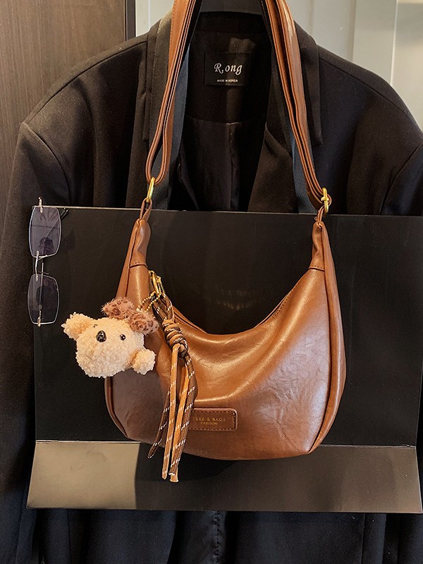Bolsa de moda coreana bolsas de bollo de moda mujeres 2025 nuevo estilo simple ocio textura alta versátil mochila de hombro