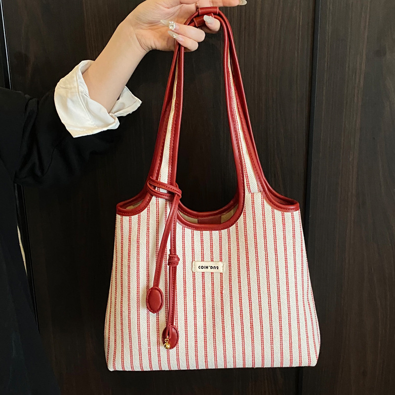 小众条纹单肩包2025韩系简约托特包包简约百搭手提拼色字母腋下包