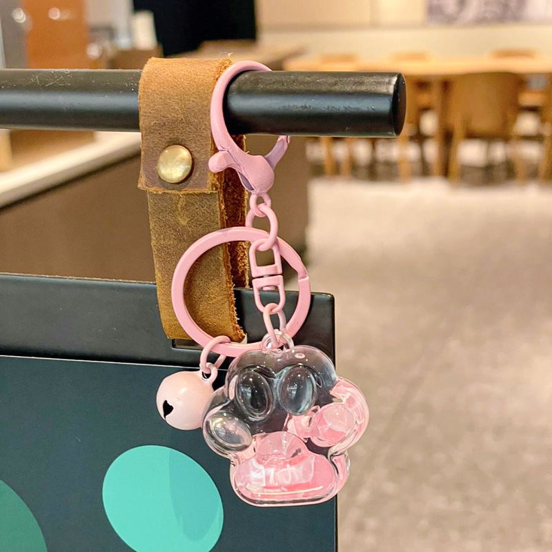Caricatura en aceite líquido arena flotante botella mochila llavero delicado colgante accesorios accesorios máquina de muñecas pequeños regalos al por mayor