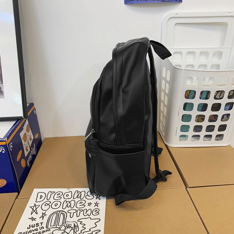 Comercio exterior nuevo estilo cuero suave gran capacidad color sólido escuela de secundaria mochila de moda masculina todo fósforo mochila simple japonesa