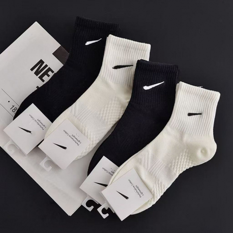 Solid color black and white all-season matching socks, trendy socks with embroidered massage soles, NK socks, unisex short, medium, and long socks