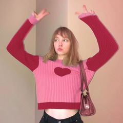 欧米のクロスボーダーのファッションの婦人服の秋冬の衝突色の百合の修身のセーターの上着の女性の丸首の長袖の中でニットの服を掛けます。