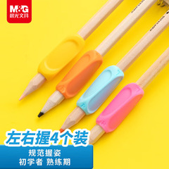 朝の光のペンを握る器の幼稚園の小学生は姿勢の矯正器を握ります。