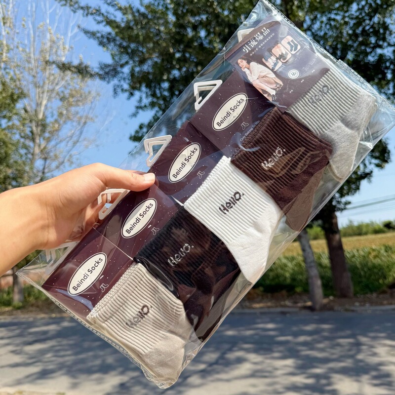 New autumn and winter styles: Korean and Japanese-inspired, fresh and simple mid-calf socks, featuring milk coffee and oatmeal colors, cartoon designs, and a sporty, preppy style