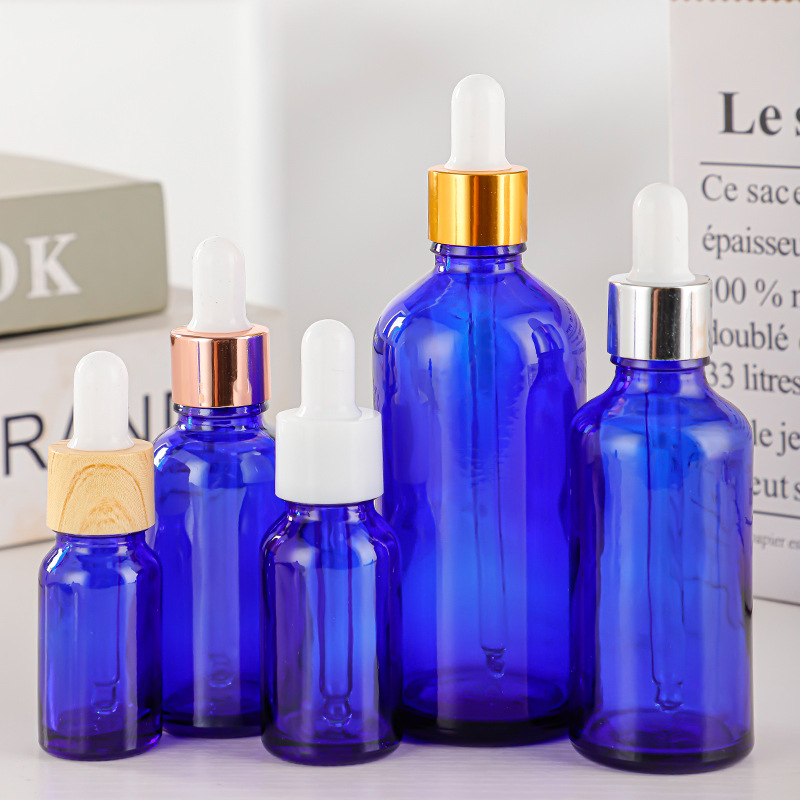 Botella de vidrio azul botella de aceite esencial botella de muestra botella de vidrio gotero botella comercio electrónico transfronterizo botella de esencia de loción