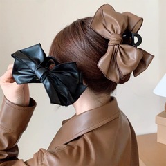 フランスのレトロな皮質の蝶結びは大きいサイズのファッション的な後頭部を挟みます。
