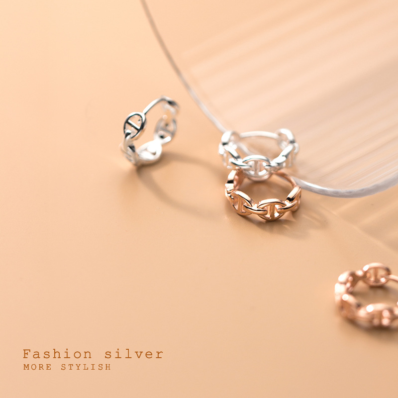 Eloch S925 botón de orejas de plata femenina versión coreana simple nariz de cerdo de moda temperamento geométrico hueco auriculares G8393