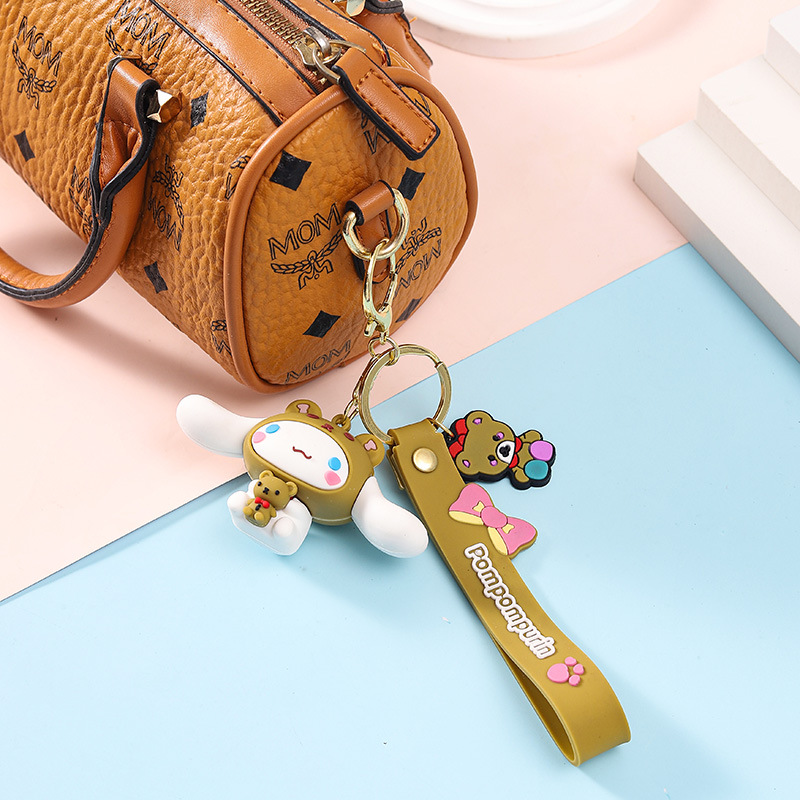 Sanrio sosteniendo pequeño animal llavero muñeca bolsa colgante ciego caja llavero muñeca máquina empuje pequeño regalo al por mayor