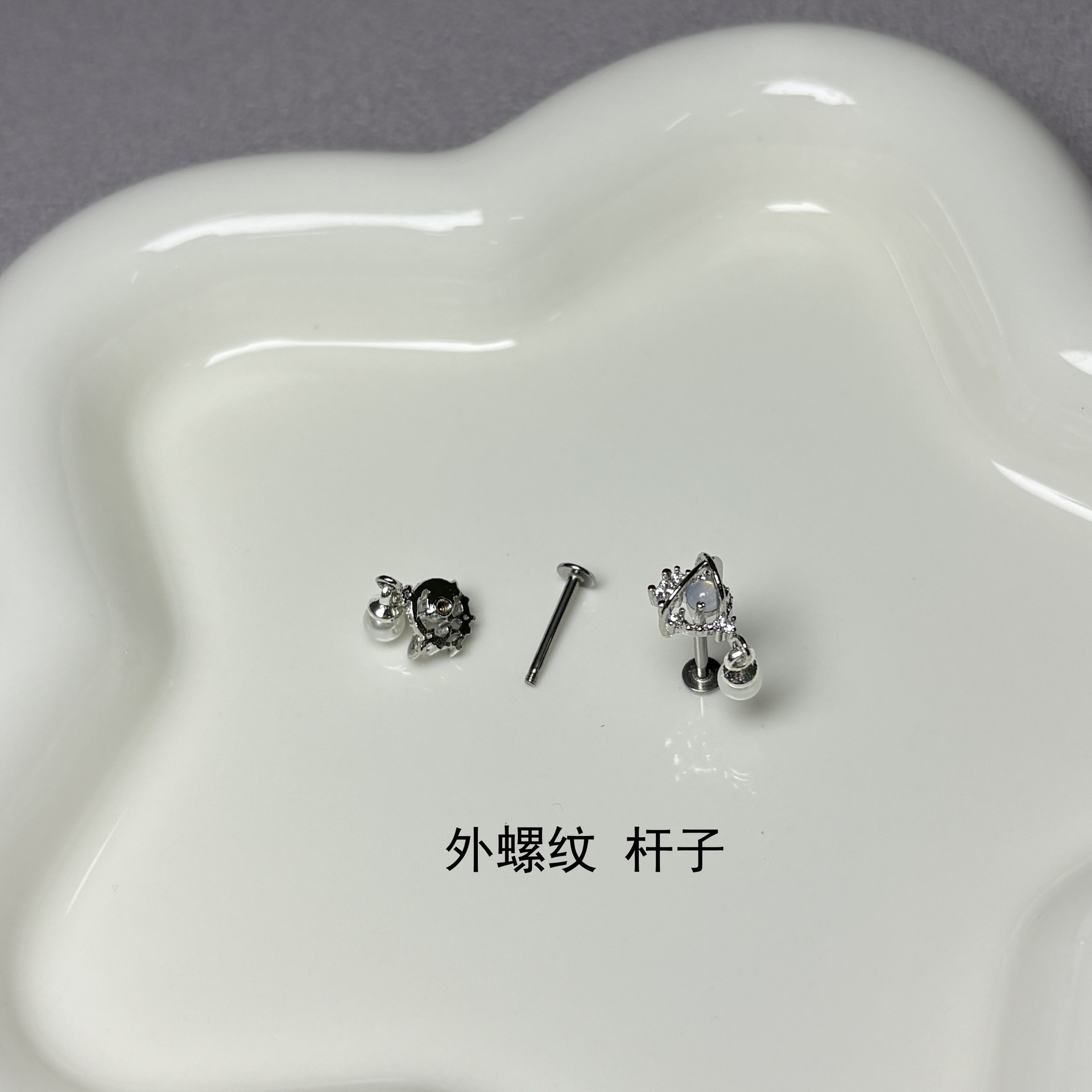 Silver pointed spike labret stud material detail