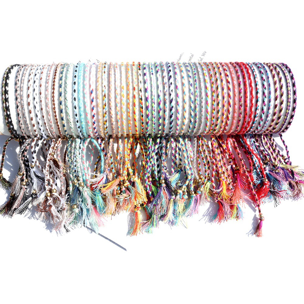 Amazon popular colorido cuerda de algodón amistad pulsera perlas de cobre borla pulsera tejida a mano ajustable hombres y mujeres pulsera