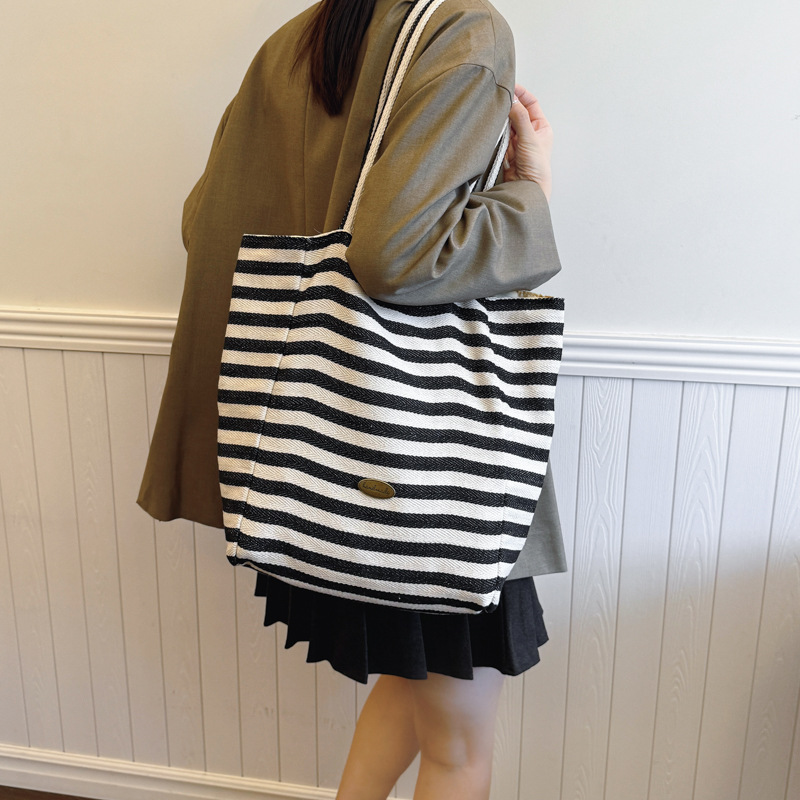 Bolsas de lona a rayas de doble cara nicho de mujeres coreanas de gran capacidad perezosa bolsas de compras de ocio de estudiantes