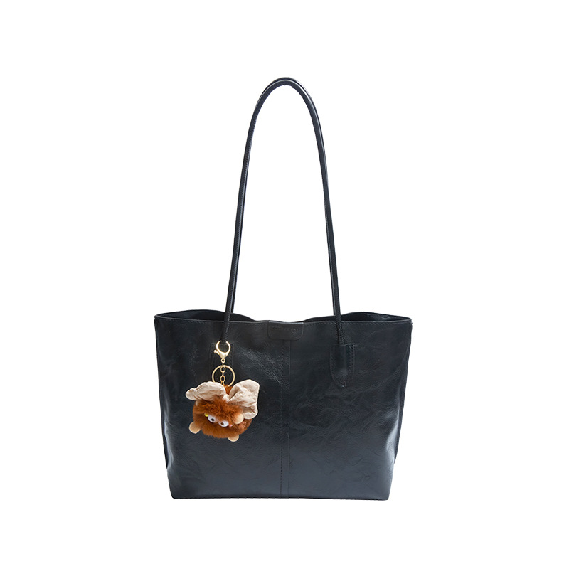 Moda de gran capacidad de la cara suave 2025 primavera nuevo colgante de ocio retro color sólido simple bolso de hombro axilar de mano