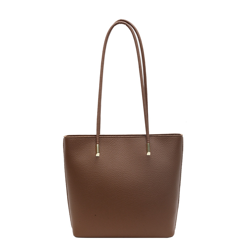 Bolso de viaje de moda simple para mujeres 2024 nuevo retro versátil bolso de hombro de nicho de alto nivel bolso de cubo