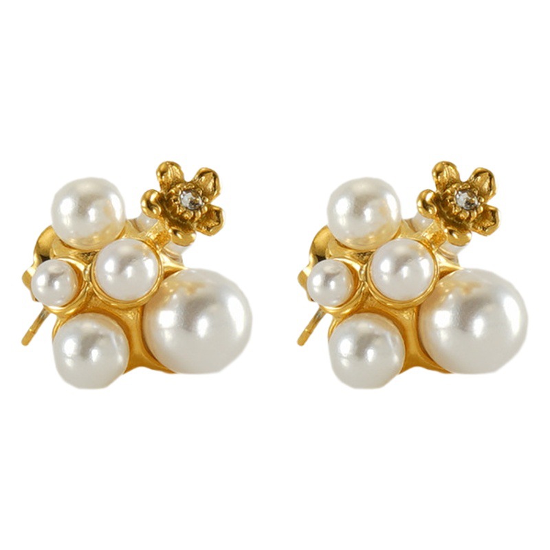 Cross-border nuevos pendientes de perlas de acero inoxidable femenino europeo y americano nicho irregular diseño luz pendientes de lujo pendientes al por mayor