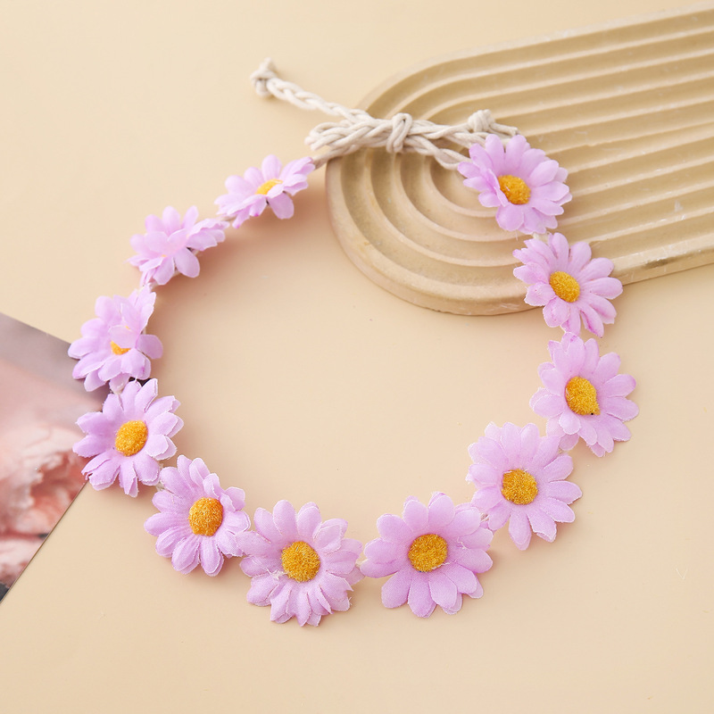 女性の女の子のヘアバンドは11輪の花の頭を編んで小さい太陽の花を持って旅行します。|undefined