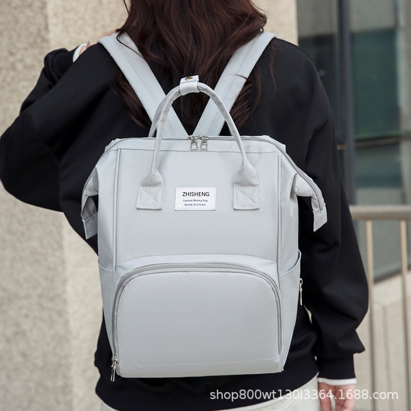 Transfronterizo nuevo bolso de mamá multifuncional portátil de mano ligero bolso de hombro madre-bebé de gran capacidad madre fuera mochila al por mayor