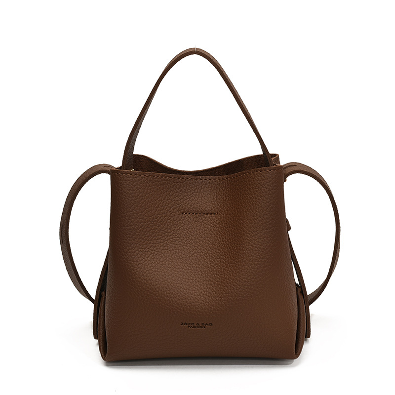 Bolso de mano de alta sensación, bolso de cubo de gran capacidad para mujeres, otoño y invierno 2025, nuevo estilo de moda bolso de hombro, bolso de mochila versátil