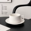Polka dot ceramic coffee cup and saucer-white