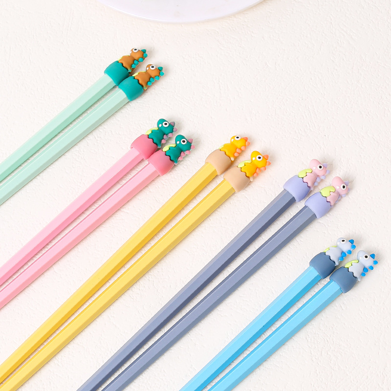 Lindos palillos de aleación de dibujos animados al por mayor Macarons de alto valor cabeza de dinosaurio comida separada una persona palillos al por mayor