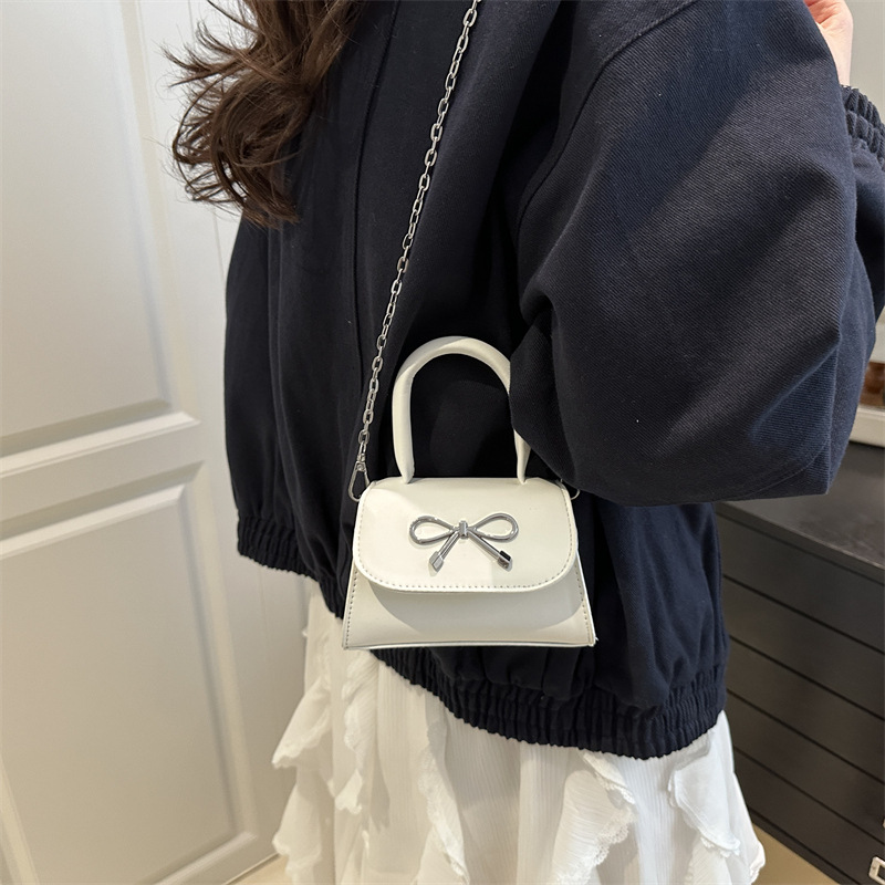 Fashionable solid color capacious one-shoulder bag with bow