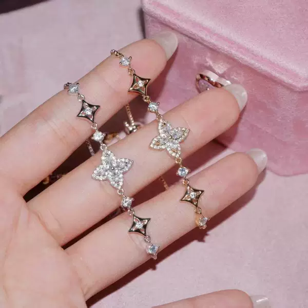 TikTok hot item: Full-diamond iris flower bracelet with adjustable pull cord, offering a light luxury and high-end feel, cross-border four-leaf clover jewelry wholesale