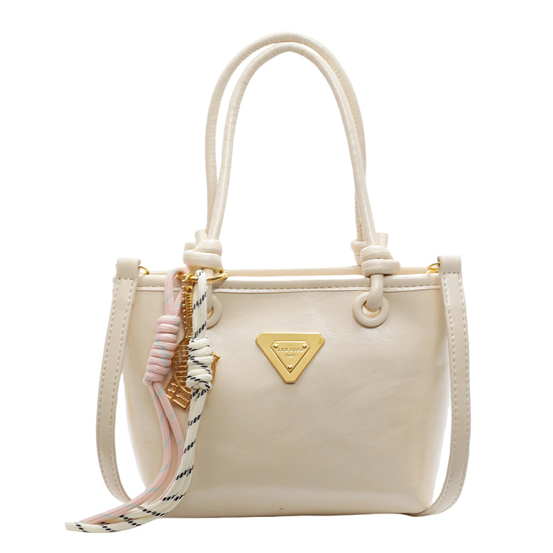 Bolso de mano simple de estilo extranjero para mujeres 2025, nuevo bolso de cubo de alta calidad, bolso de hombro casual simple