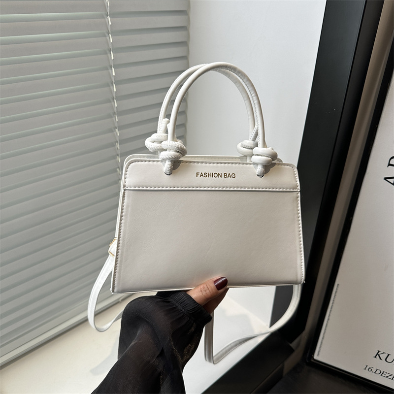 Bolso pequeño portátil retro estilo occidental mujer 2025 nuevo bolso cuadrado pequeño simple moda moda color contraste bolso de hombro