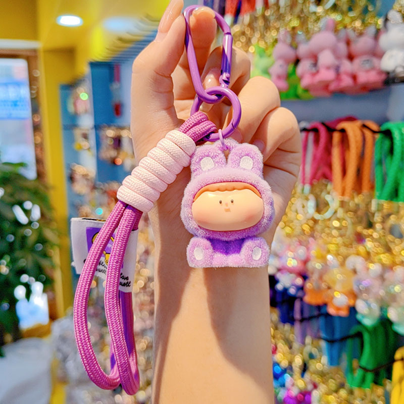 Caricatura floc amarelis llavero de automóvil pareja colgante bolsos creativos colgar garra máquina regalos al por mayor