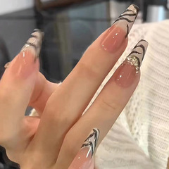 Internet-famous rhinestone zebra-print nail art, faux nails with striped and French designs—bold, sweet, edgy, and Instagram-worthy wearable nail tips