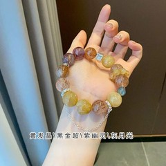 天然の黄色の結晶の黒い金の超手の串の女性の高級感の貴気の精巧なファッションの天然の水晶の手は大きなビーズを飾ります。