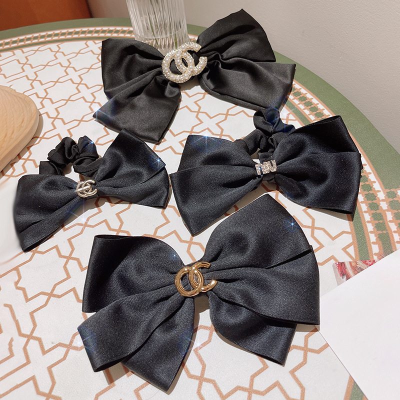Black cute hairgrip with letters with bow