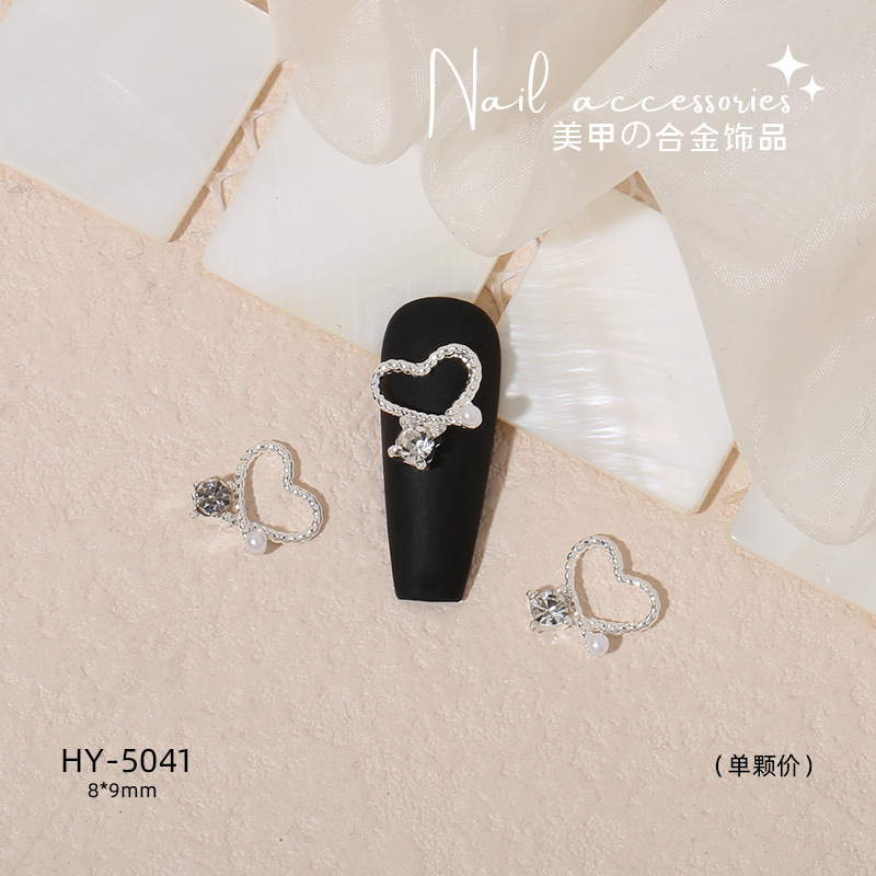 Nuevo arco de uñas amor aleación decoración de uñas flor de la luna mariposa clavo taladro fábrica joyería al por mayor