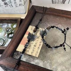 水墨のぼかし染めの蝶のブレスレットの新しい中国式の手編みのシンプルな古風のカップルの同じタイプの手飾りの引き出しは調節できます。