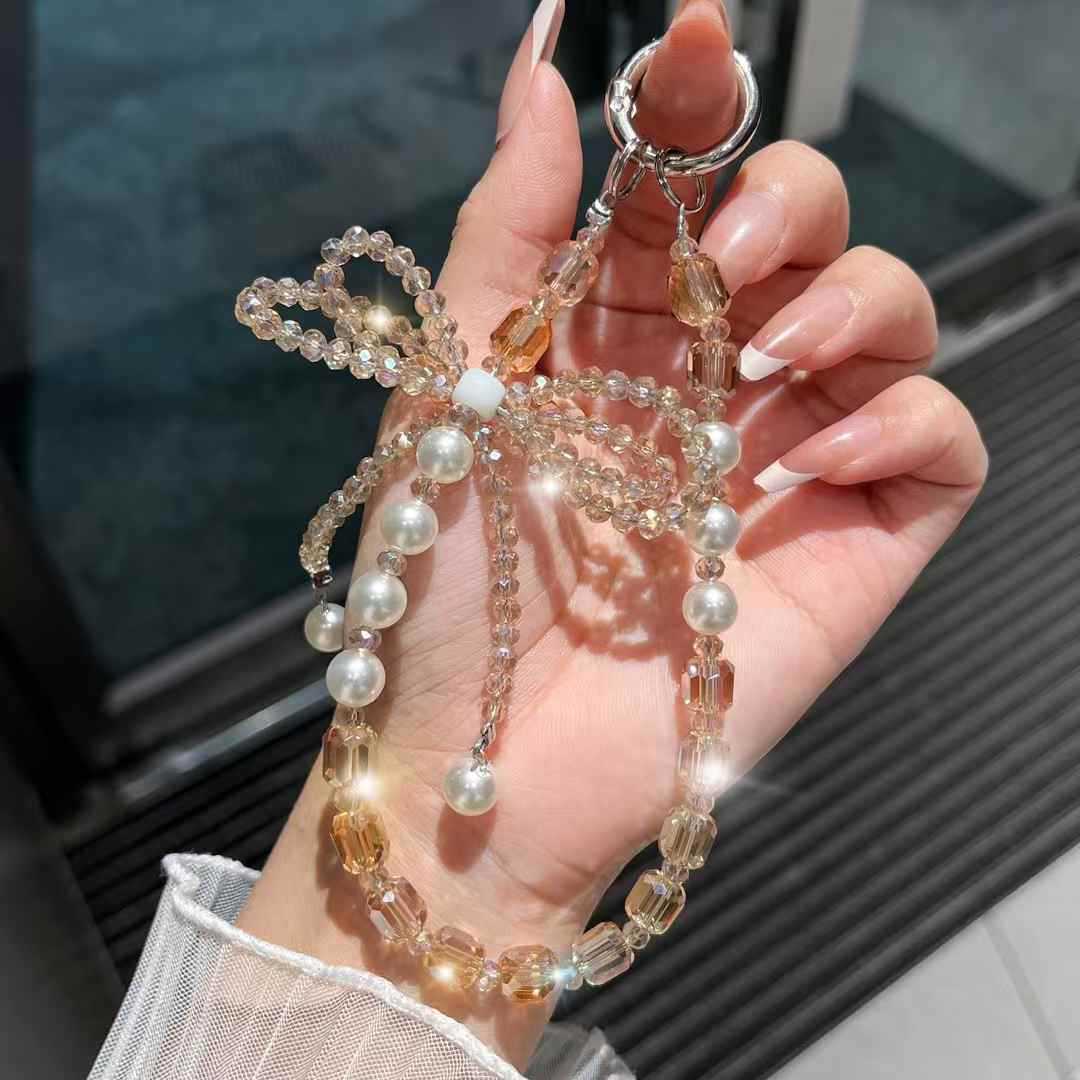 cadena de teléfono móvil estereoscópico de alta calidad arco de cristal caja de teléfono móvil colgante perla cuerdas de muñeca cuerdas de cuentas mujeres