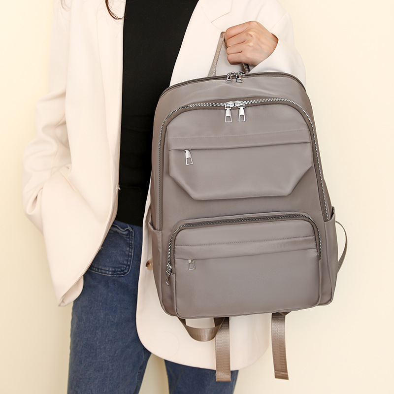 Mochila de nuevo estilo transfronteriza para mujer, mochila escolar de viaje multifuncional de gran capacidad de nailon, bolso de mano tipo bandolera de un solo hombro