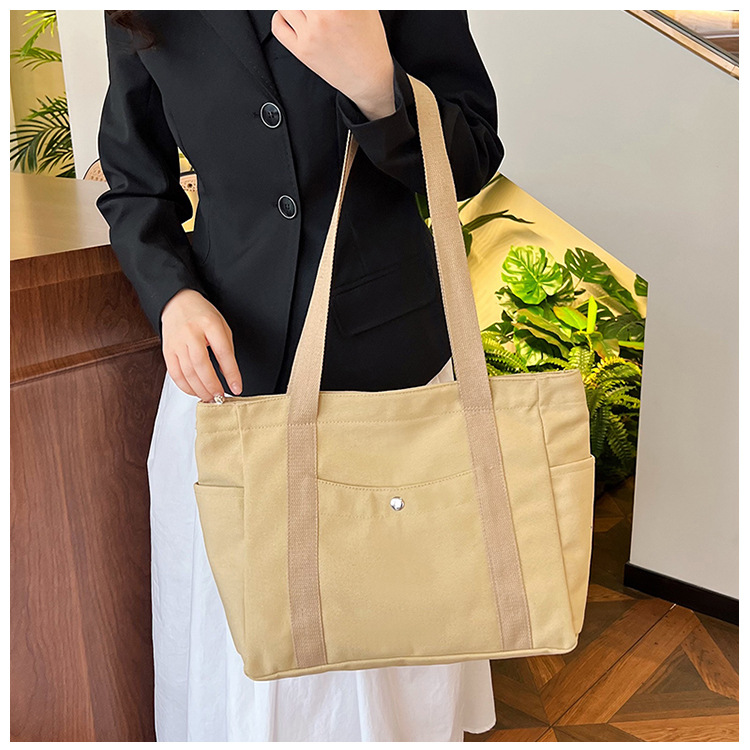 Wholesale of new women's single-shoulder bags, cross-border simple and casual canvas bags, Korean version LOGO printed commuter tote bags undefined
