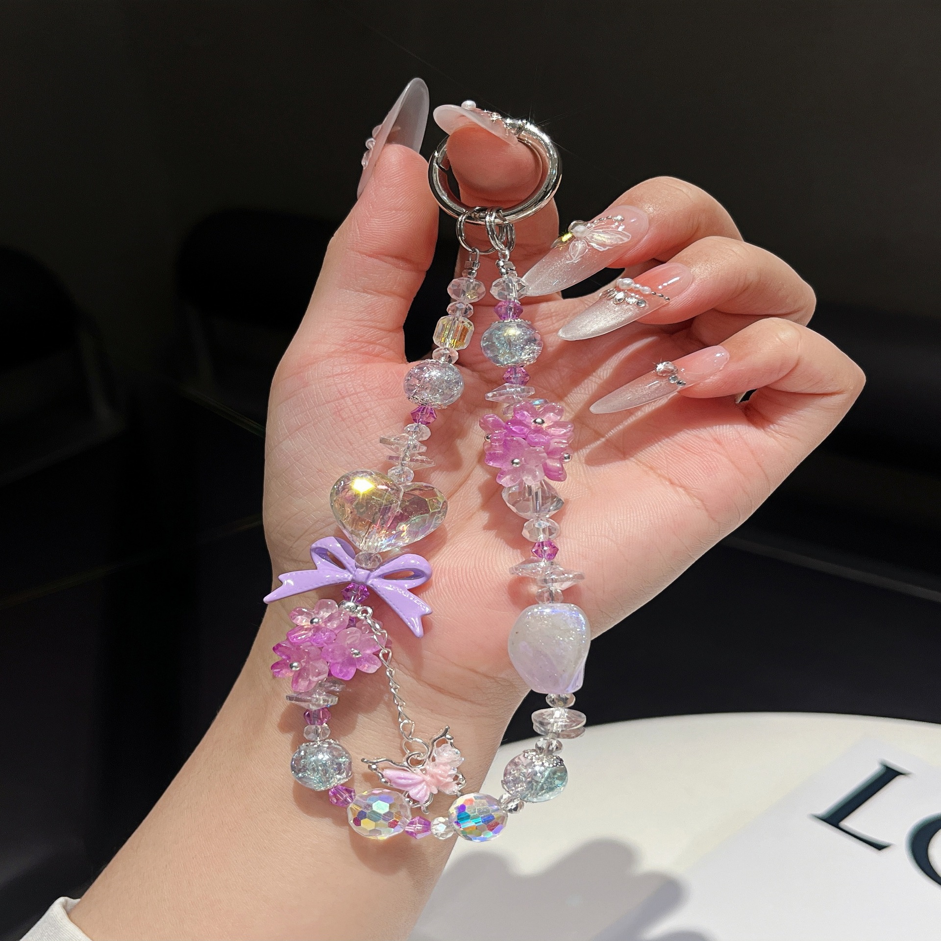 Ramo de flores de cristal fresco, amor, jade, mariposa, borla, cadena de teléfono móvil, cordón con cuentas de muñeca de alta gama femenina