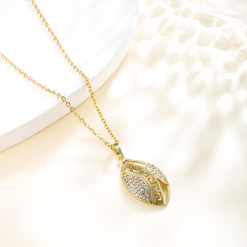 Xuping moda bronce dorado galvanoplastia piedra geometría colgante ovalado muralla mujer patrón retrógrado colgante nicho