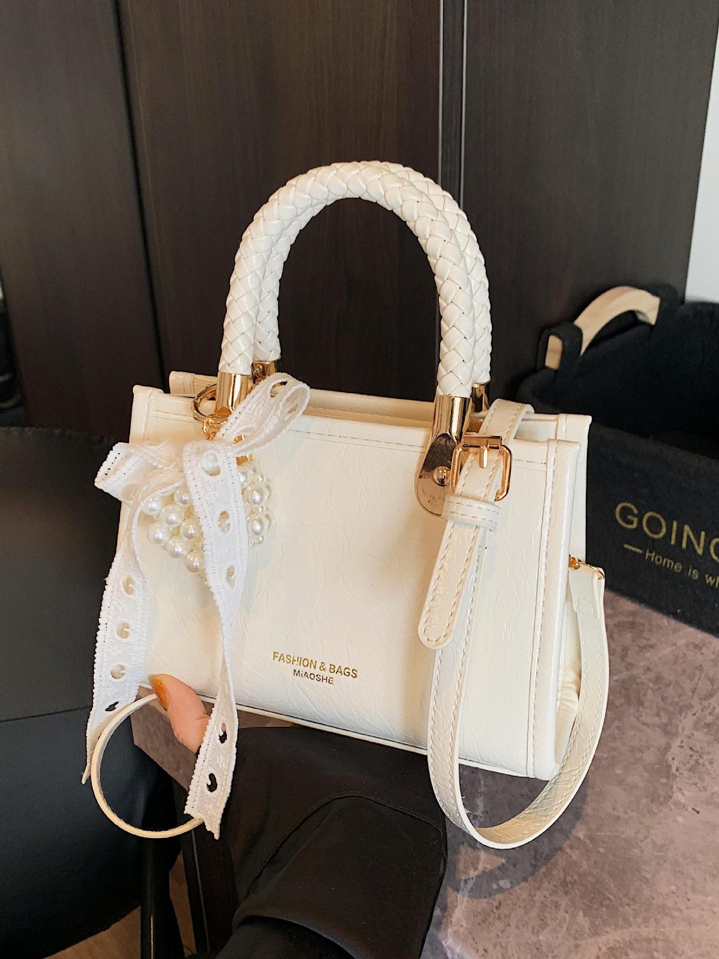 Bolso cuadrado pequeño portátil más vendido transfronterizo para mujer 2025 nuevo bolso de hombro de moda de nicho bolso de mensajero de alta gama