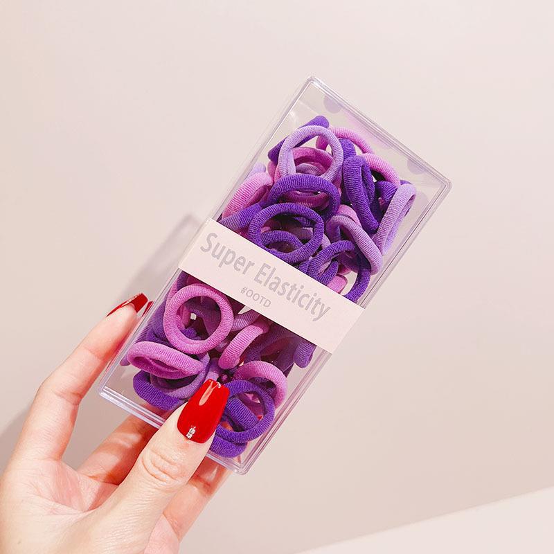 Asequible caja de almacenamiento de Corea del Sur de los niños pequeño tamaño cabeza cuerda bebé toalla anillo no duele pelo cabeza cuerda macaron pelo anillo