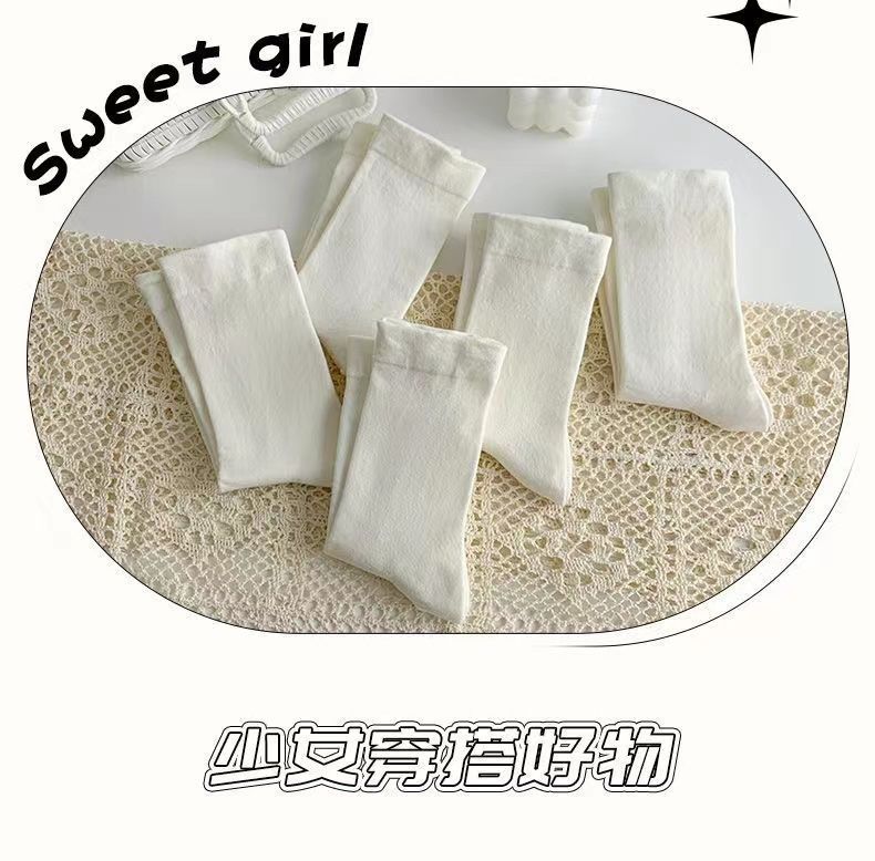 TikTok-Stil weiße nahtlose Socken für Damen, Mittelbein-Socken für alle vier Jahreszeiten, japanischer College-Stil, einfache, modische Slouch-Socken.